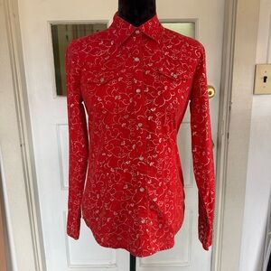 Red western-inspired button-down shirt with silver swirl print.
